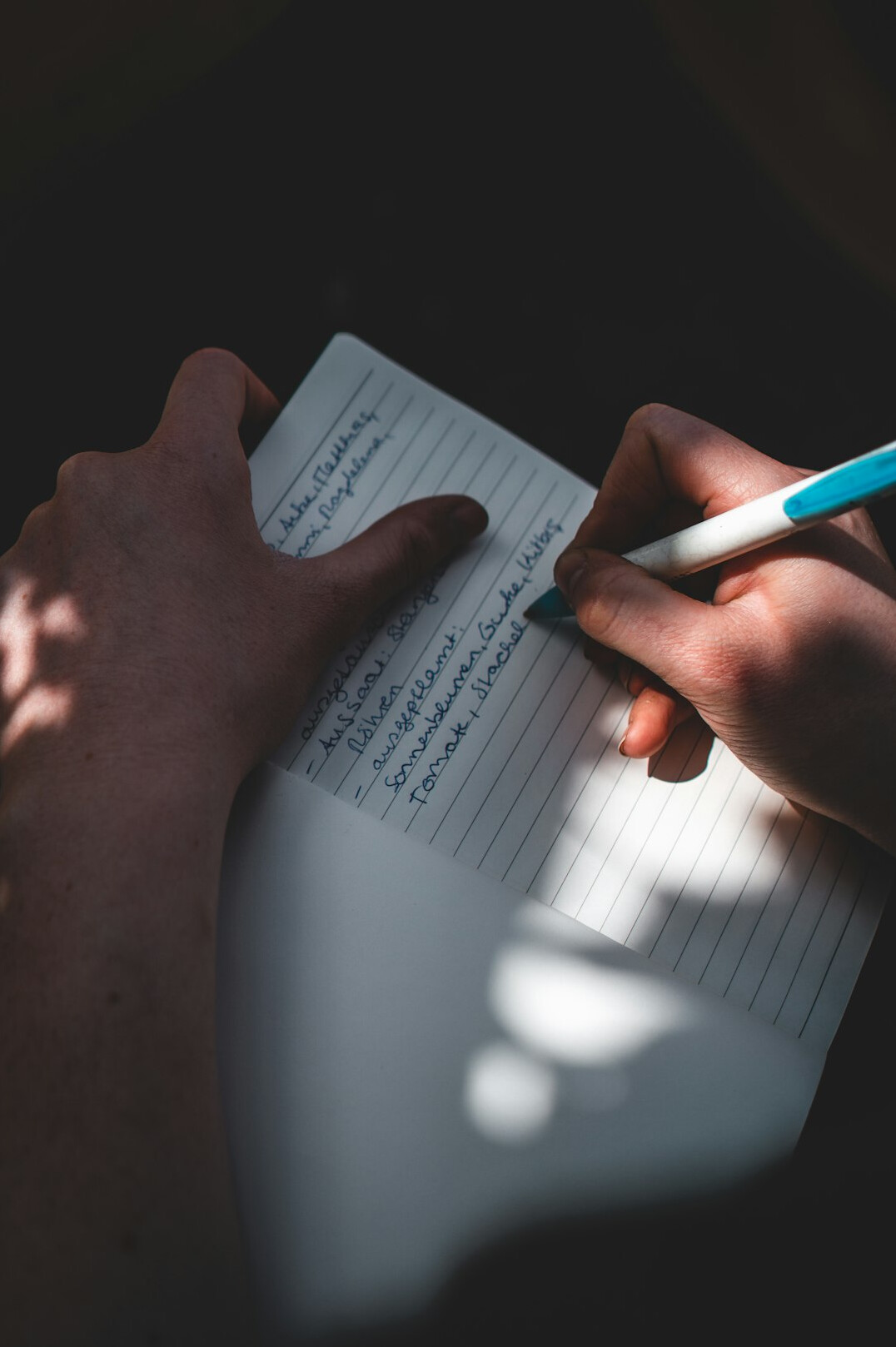 person writing letter